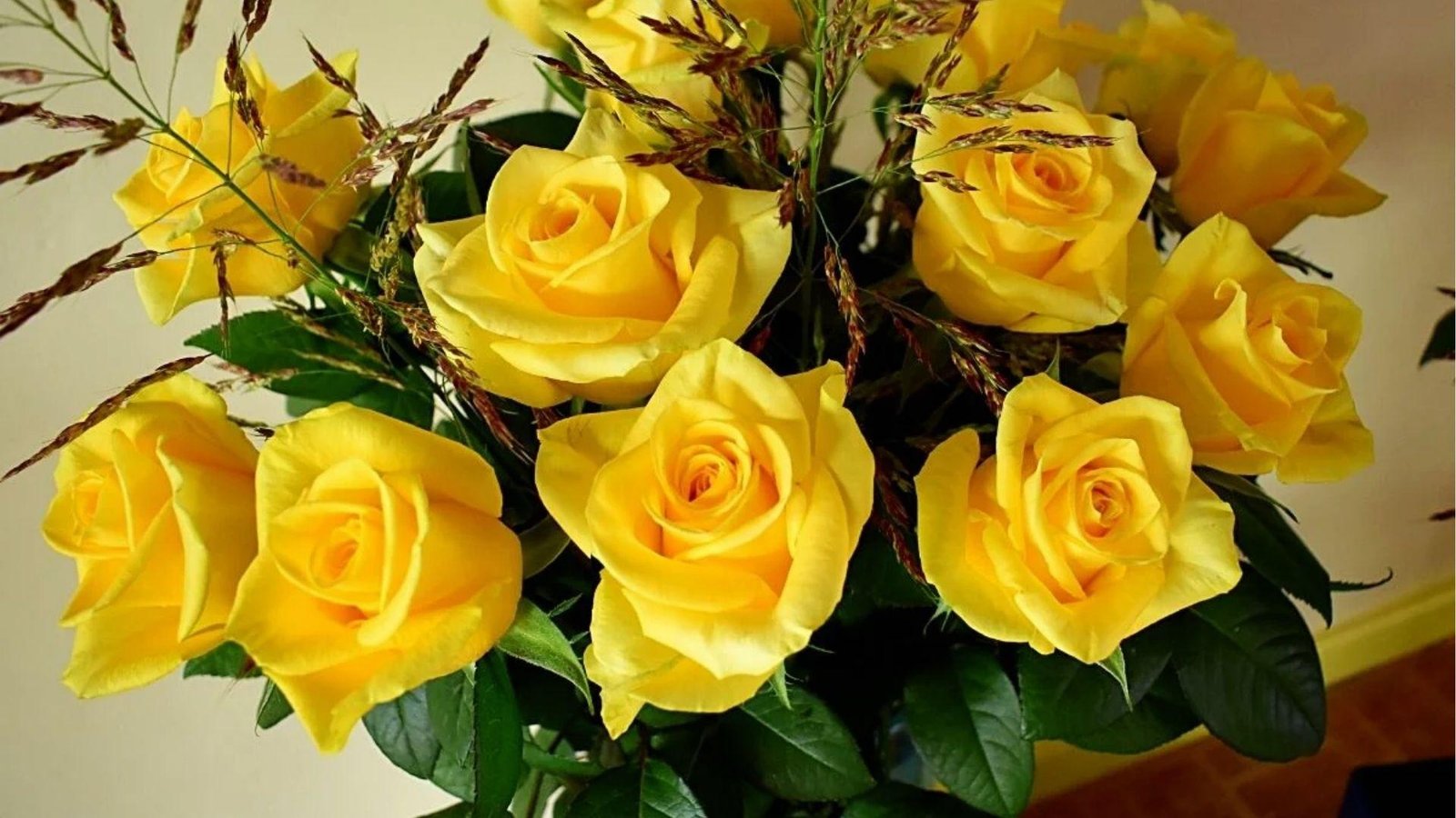 Bright yellow rose bouquet with dried accents, radiating Libra's joy, warmth, and friendship.