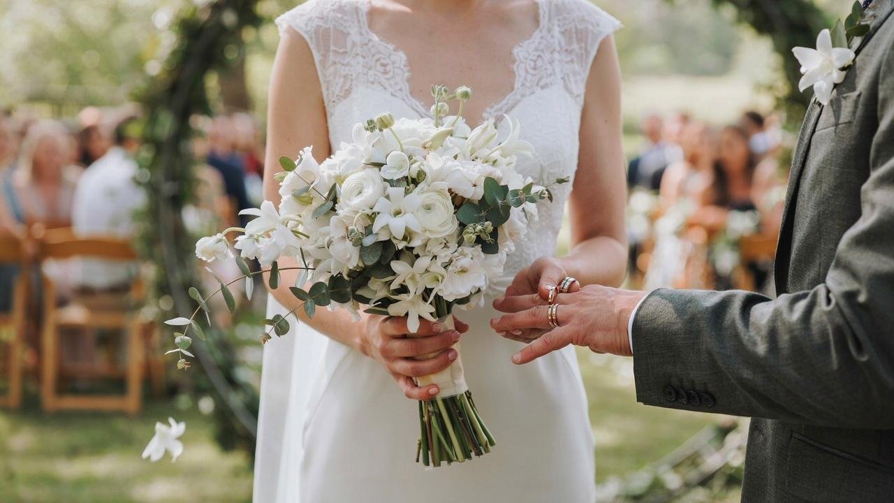 White stephanotis flowers in a classic bridal bouquet earning their reputation as the wedding flower.
