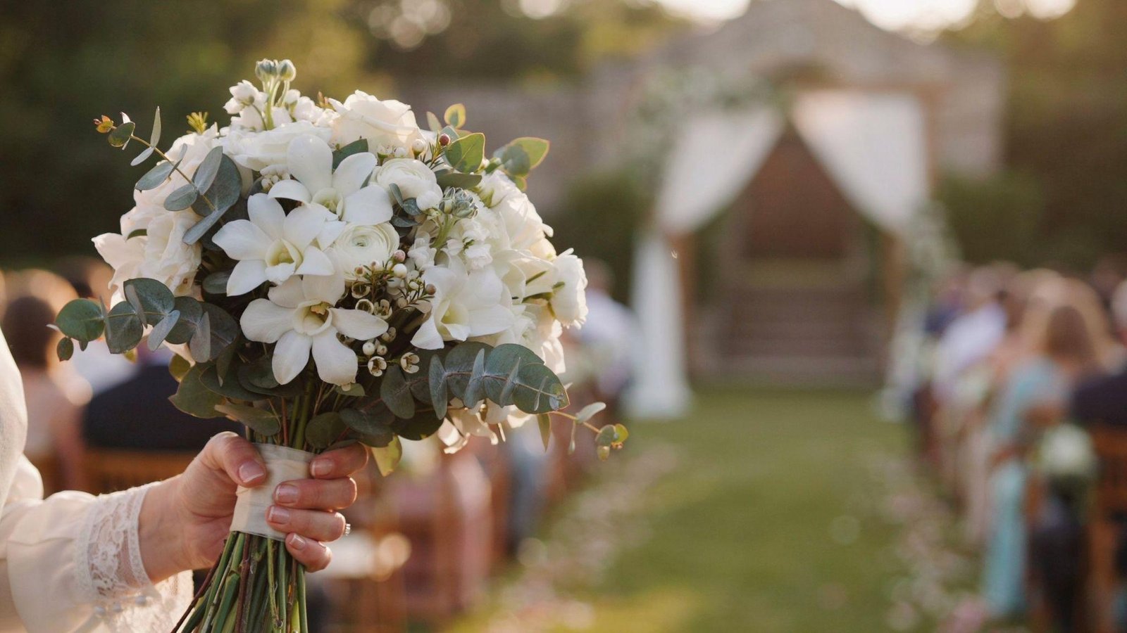 White stephanotis flowers in a wedding bouquet symbolizing marital happiness and a joyful lifelong marriage.